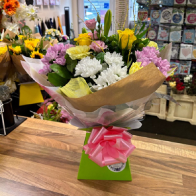 Pink and lemon  - Pink white and lemon flowers mixed into a living vase 