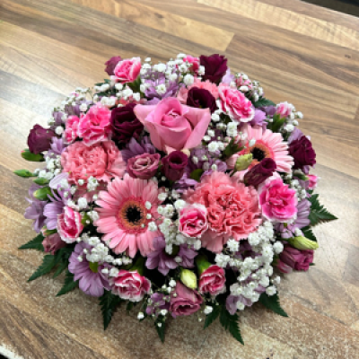Posy 101 - Mixture of flowers in shades of pink with a to inch of gypsophila