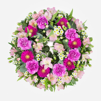 Wreath SYM-320 - Classic Wreath in Shades of Pink. A classic and beautiful arrangement to send for a funeral. 
