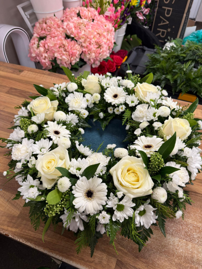 Ivory Remembrance Wreath - Elegant white remembrance wreath with ivory roses and delicate seasonal textures for a graceful and heartfelt tribute.